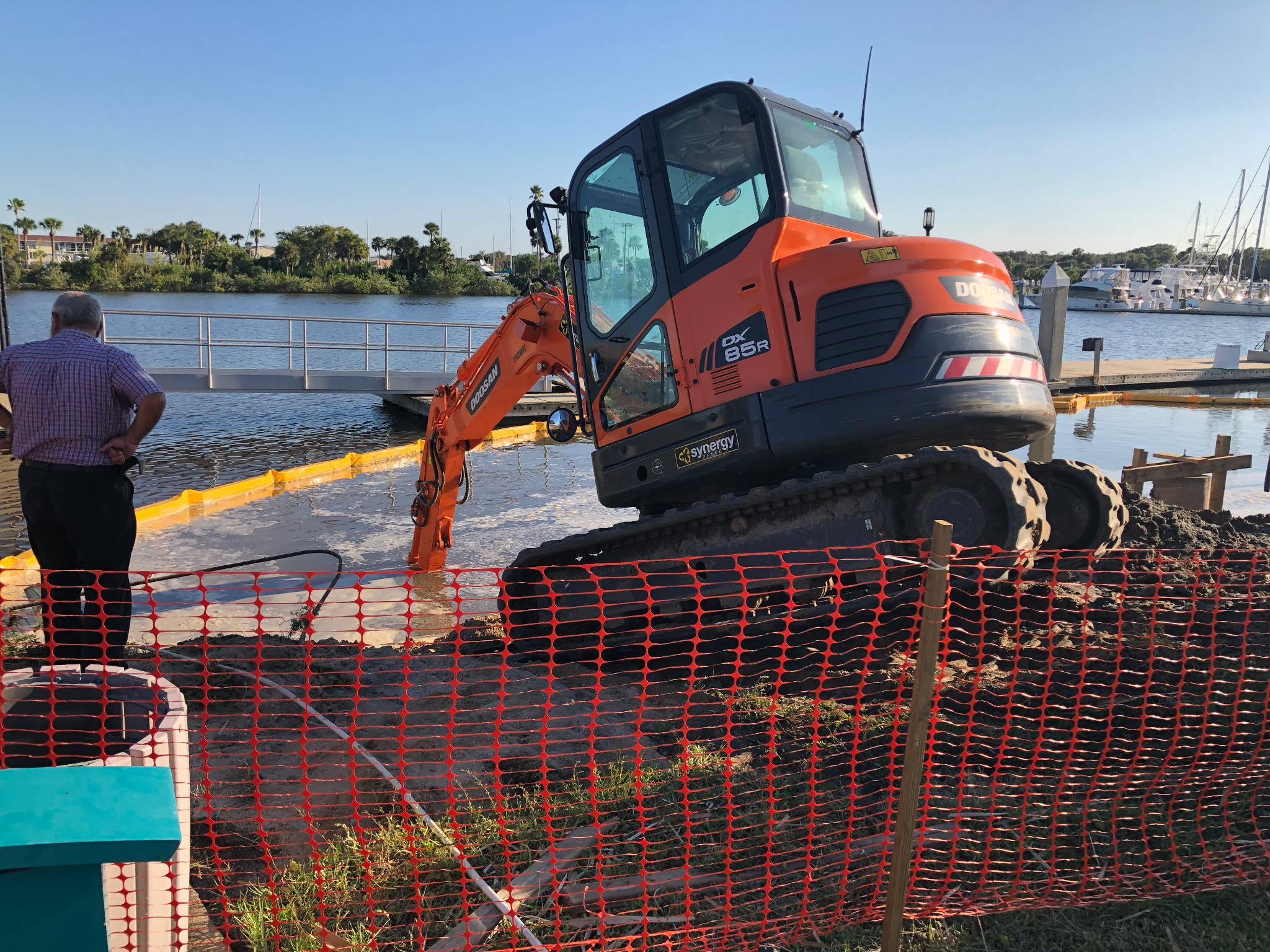 Excavator and dock work in the water